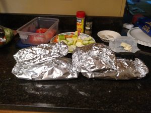 several Keto Meat and Vegetable Foil Packets on counter