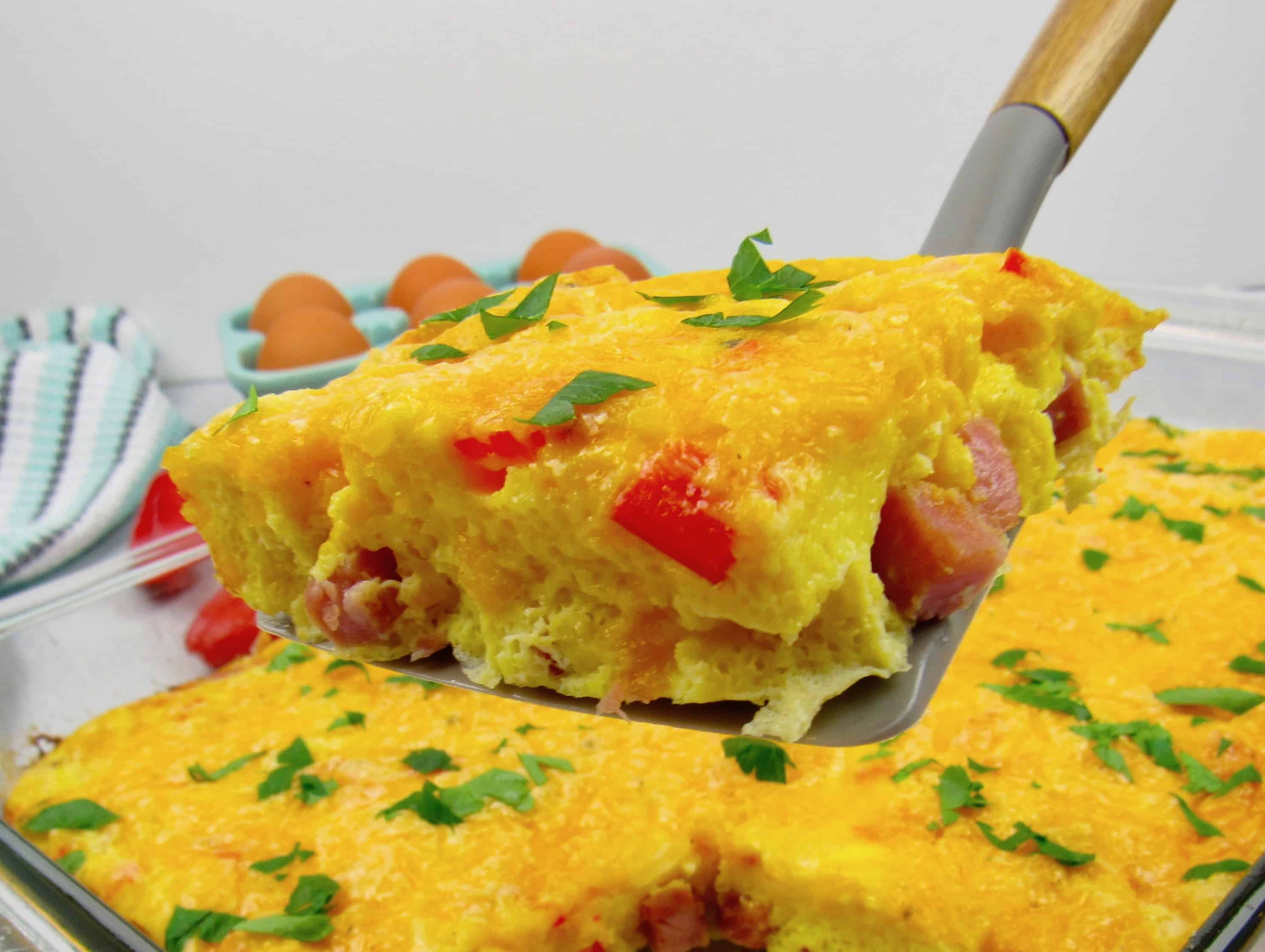 breakfast casserole slice held up with spatula