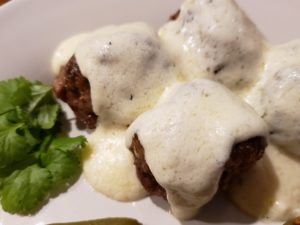 meatballs covered in alfredo sauce